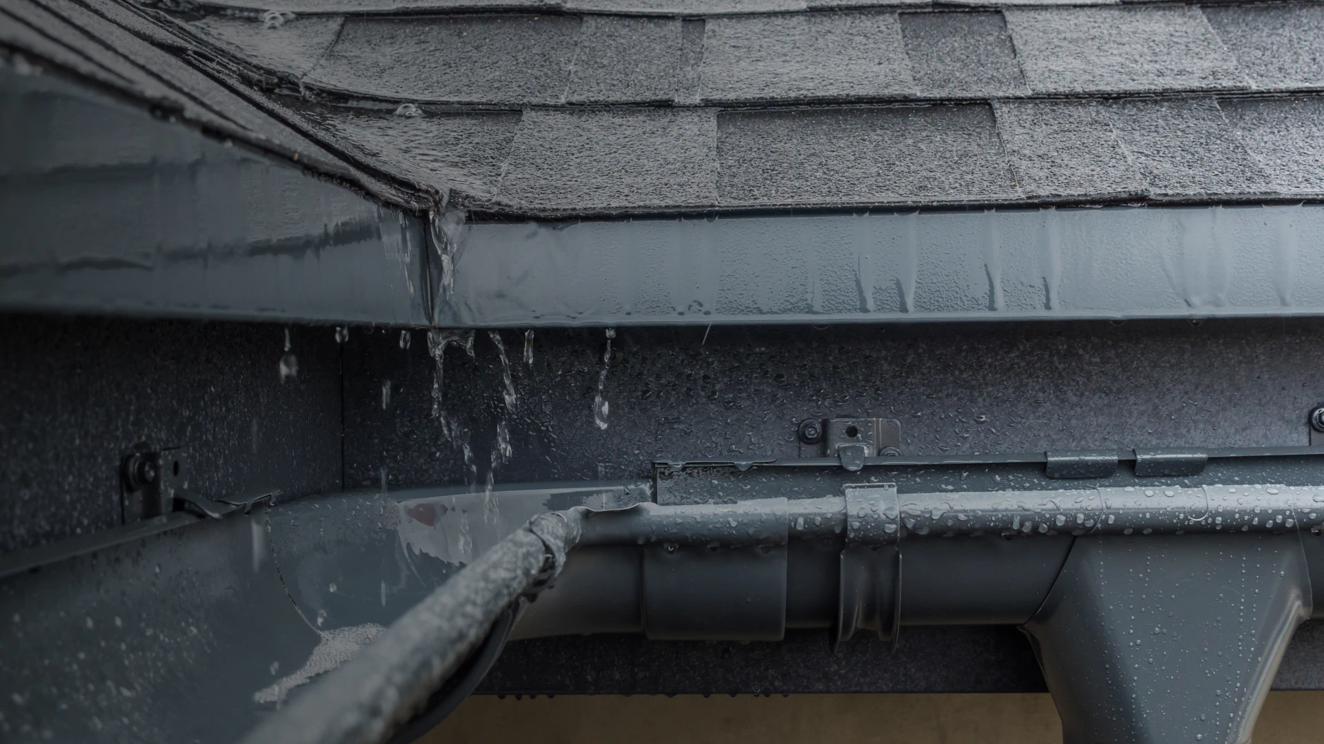 wet roof gutter due to heavy rain onsted mi
